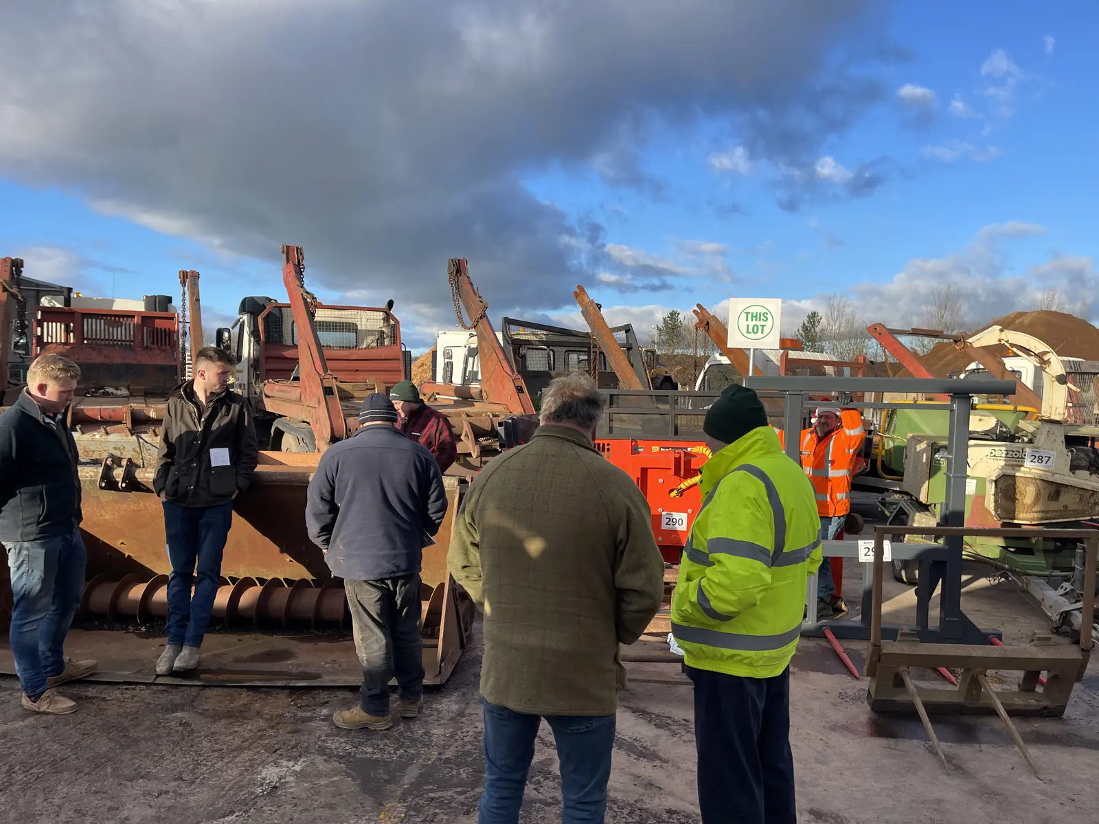 People viewing machinery together at a past Dunn Bros auction